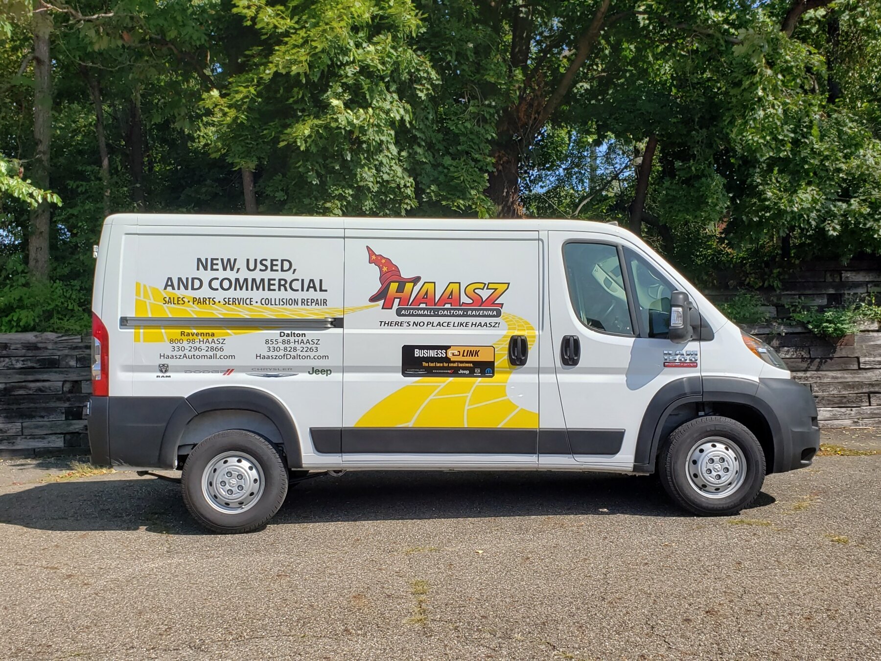 Commercial service van with a complete branded vehicle wrap